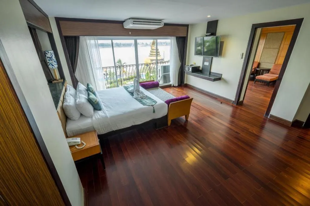 Bed in LANDMARK NAKHONPHANOM HOTEL