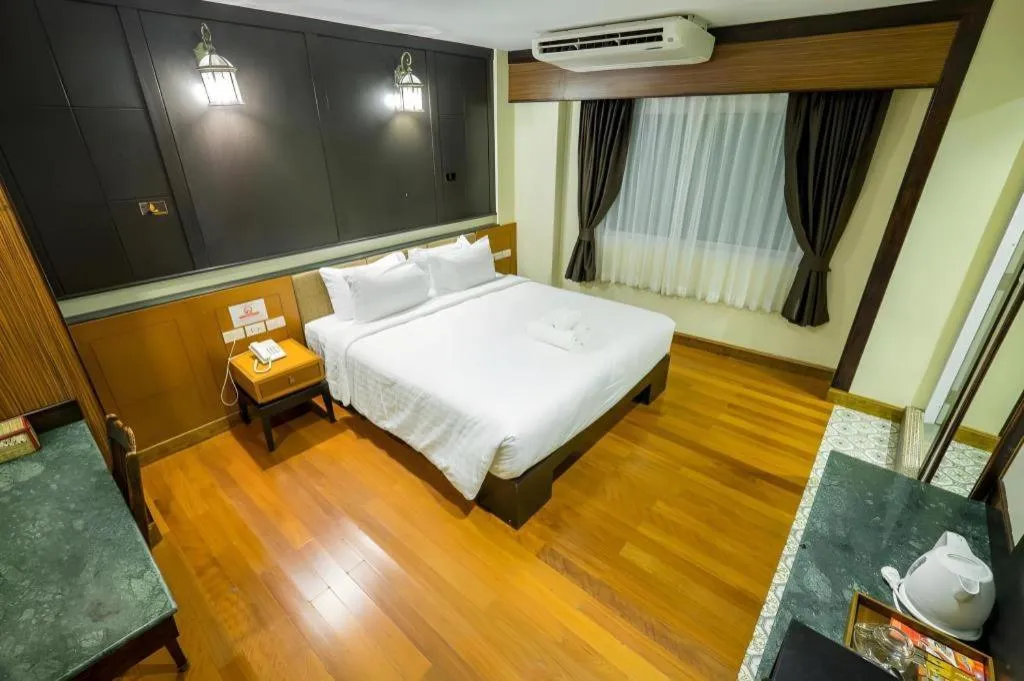Bed in LANDMARK NAKHONPHANOM HOTEL