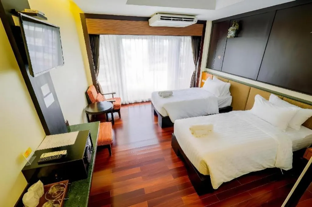 Bed in LANDMARK NAKHONPHANOM HOTEL