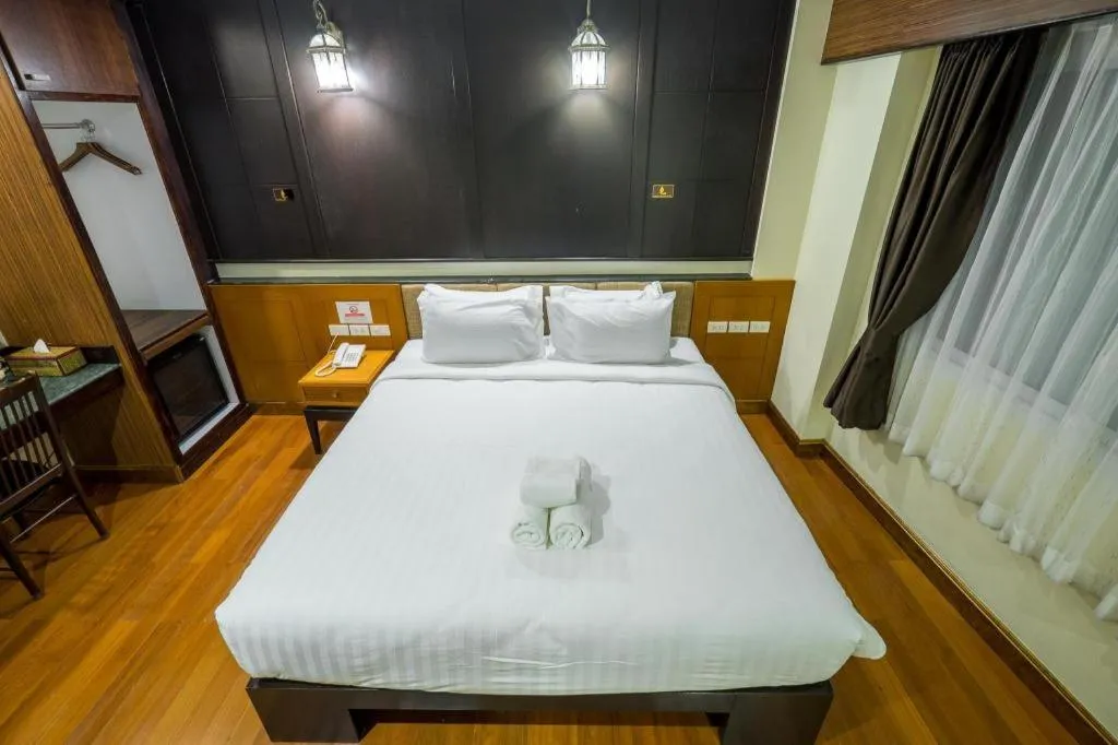 Bed in LANDMARK NAKHONPHANOM HOTEL