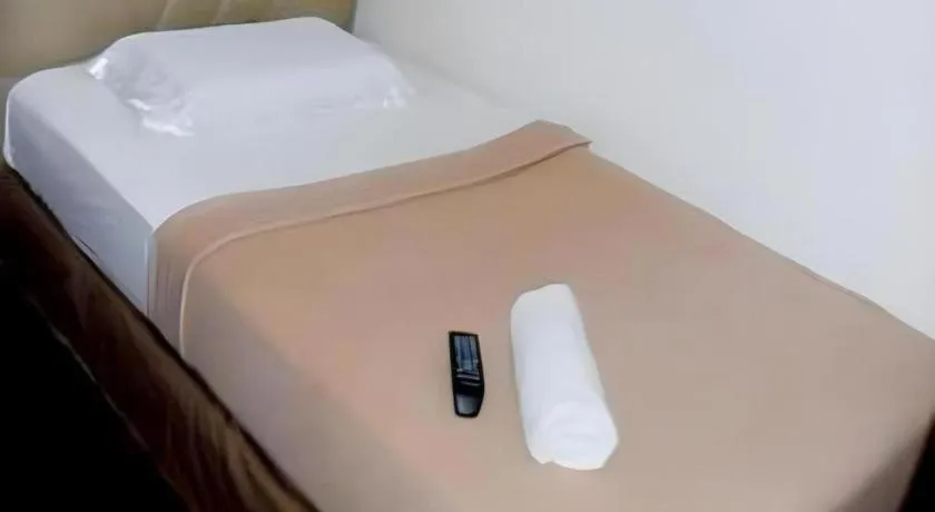 Bed in Rich Manor Pension House