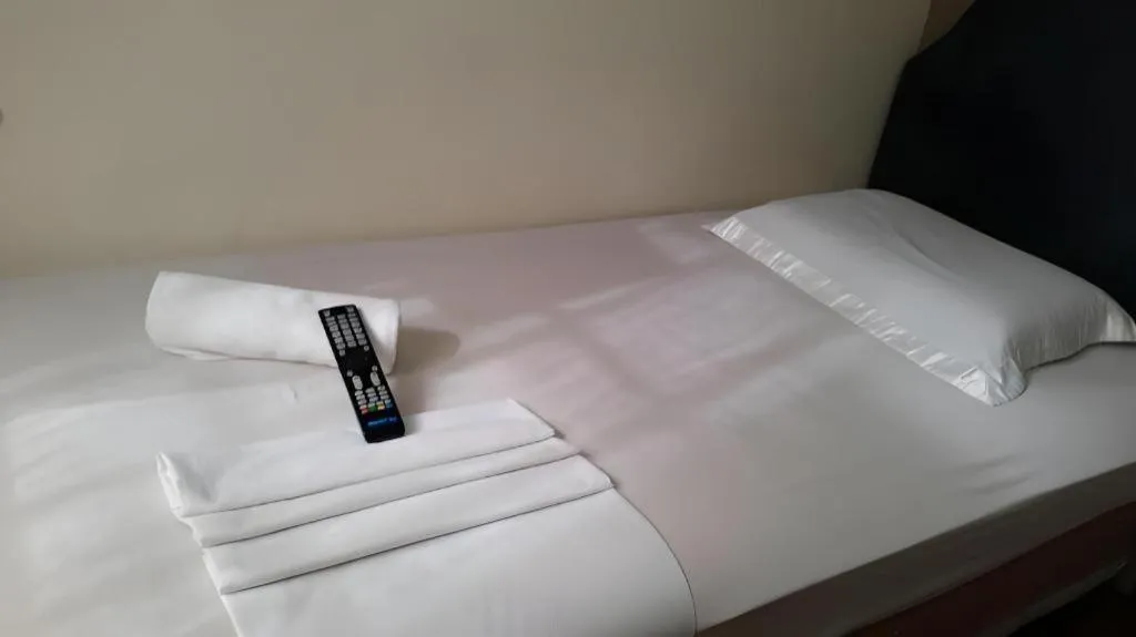 Bed in Rich Manor Pension House