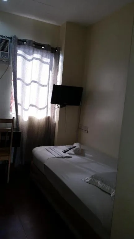 Bed in Rich Manor Pension House