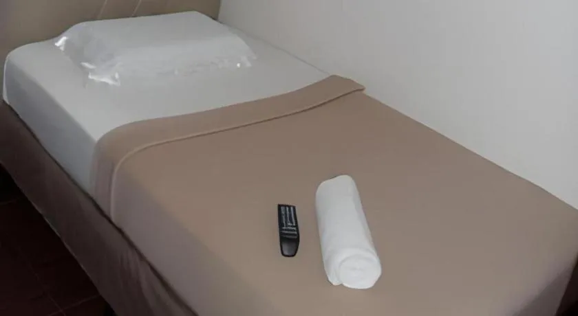 Bed in Rich Manor Pension House