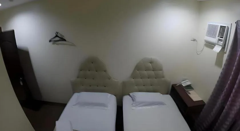 Bed in Rich Manor Pension House