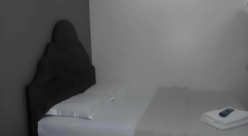 Bed in Rich Manor Pension House