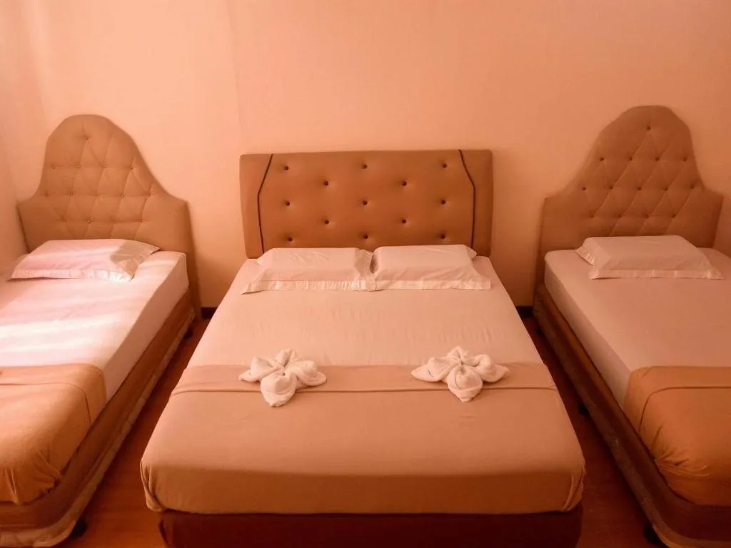 Bed in Rich Manor Pension House