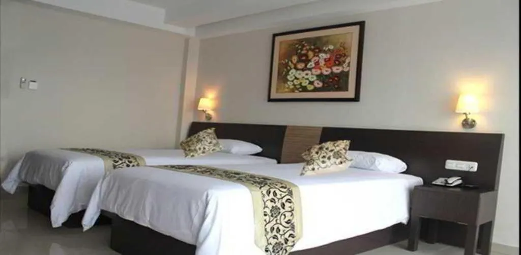 Bed in Losari Sunset Hotel