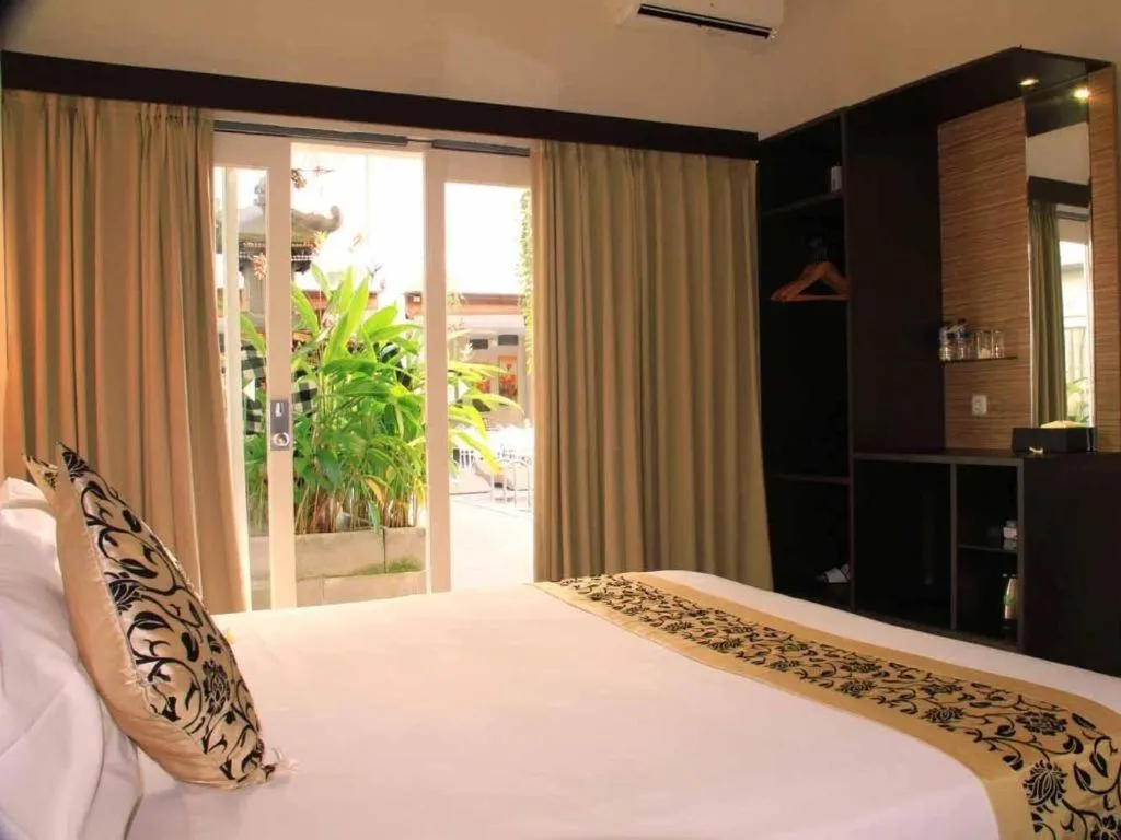 Bed in Losari Sunset Hotel