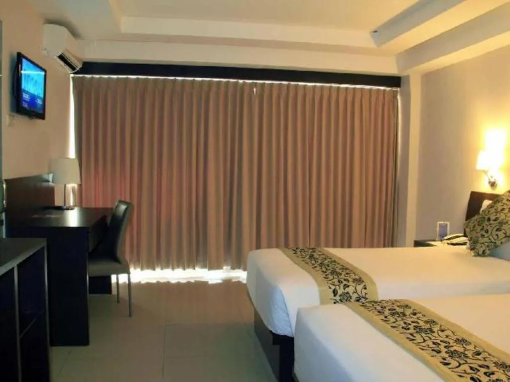 Bed in Losari Sunset Hotel