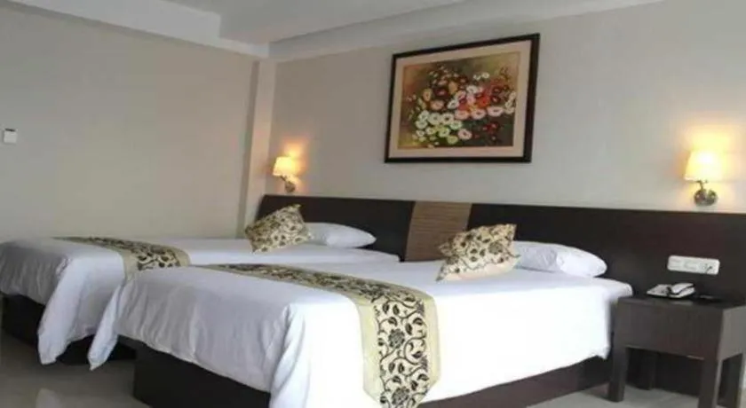 Bed in Losari Sunset Hotel