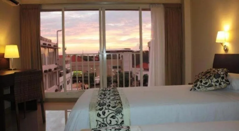 Bed in Losari Sunset Hotel