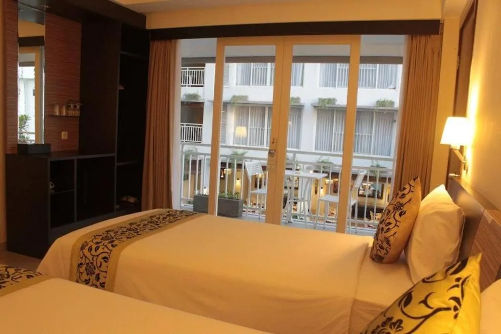 Bed in Losari Sunset Hotel