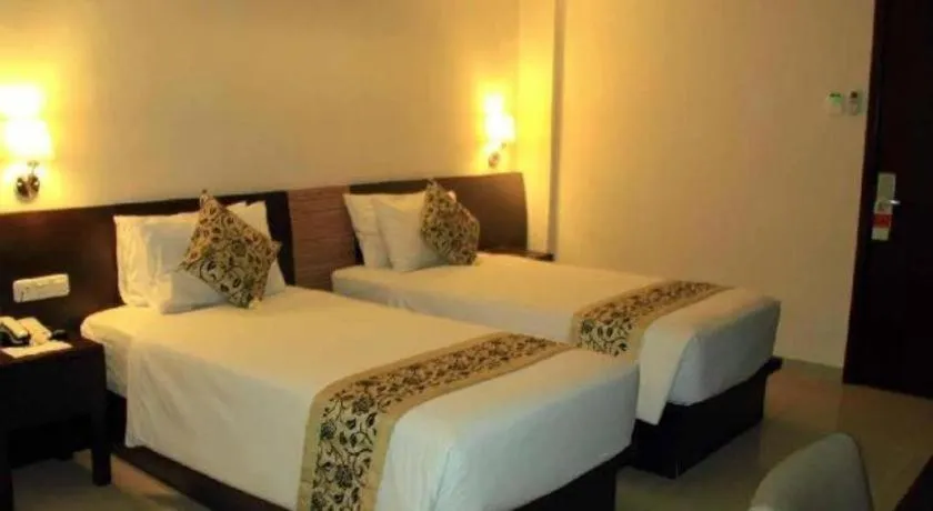 Bed in Losari Sunset Hotel