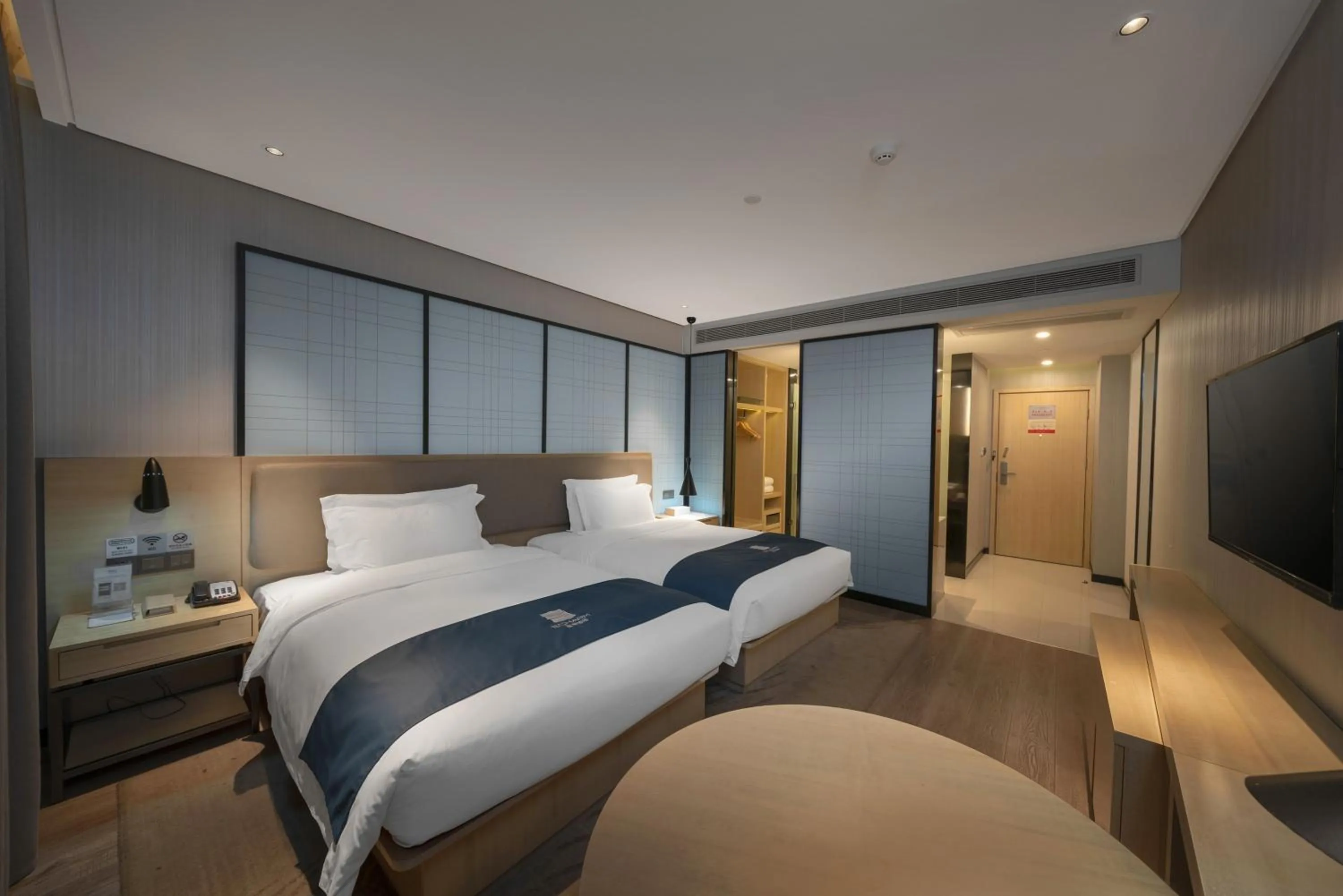 Bedroom, Bed in Echarm Hotel Haikou Zhongshan South Road East High Speed Railway Station