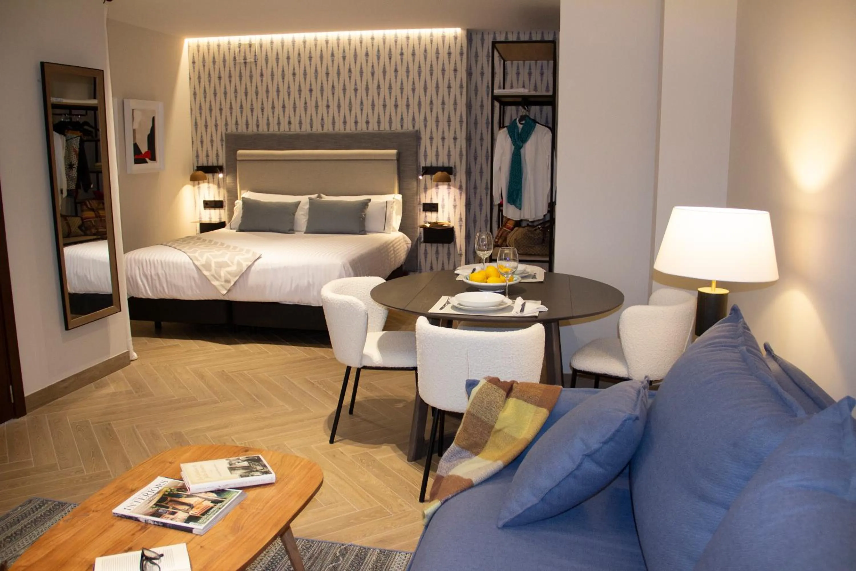 Bed in Puerta de la Ribera Suites