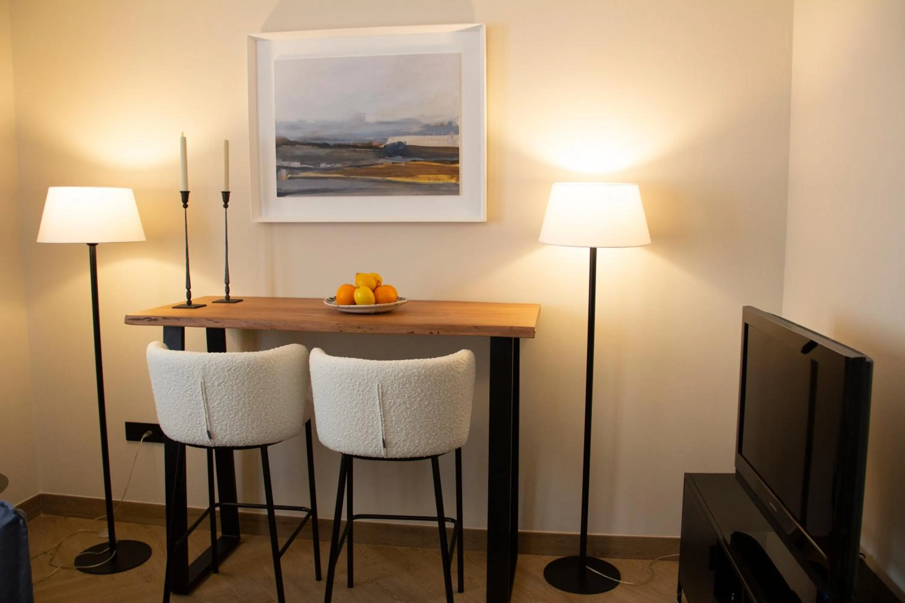 Seating area in Puerta de la Ribera Suites