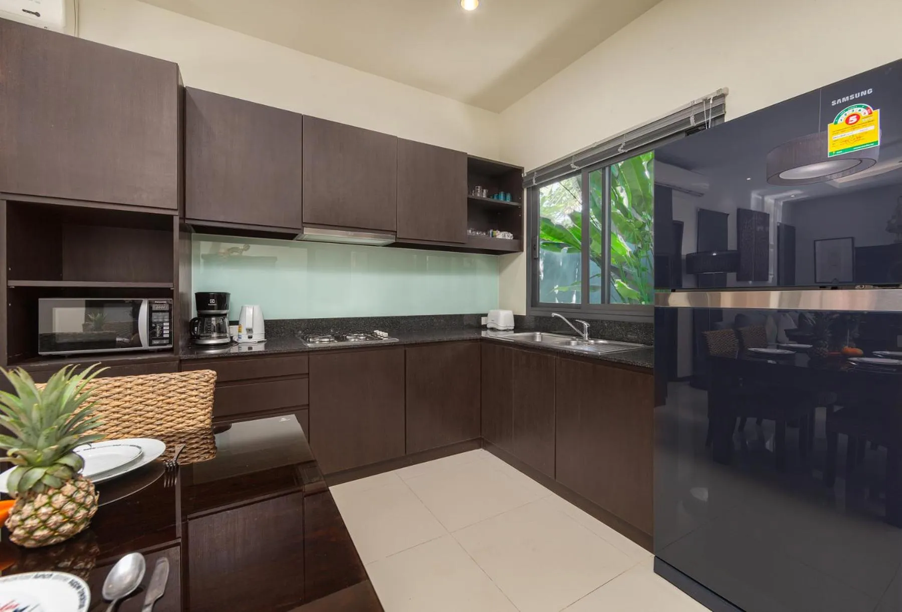 Kitchen or kitchenette in Saiyuan Estate by TropicLook