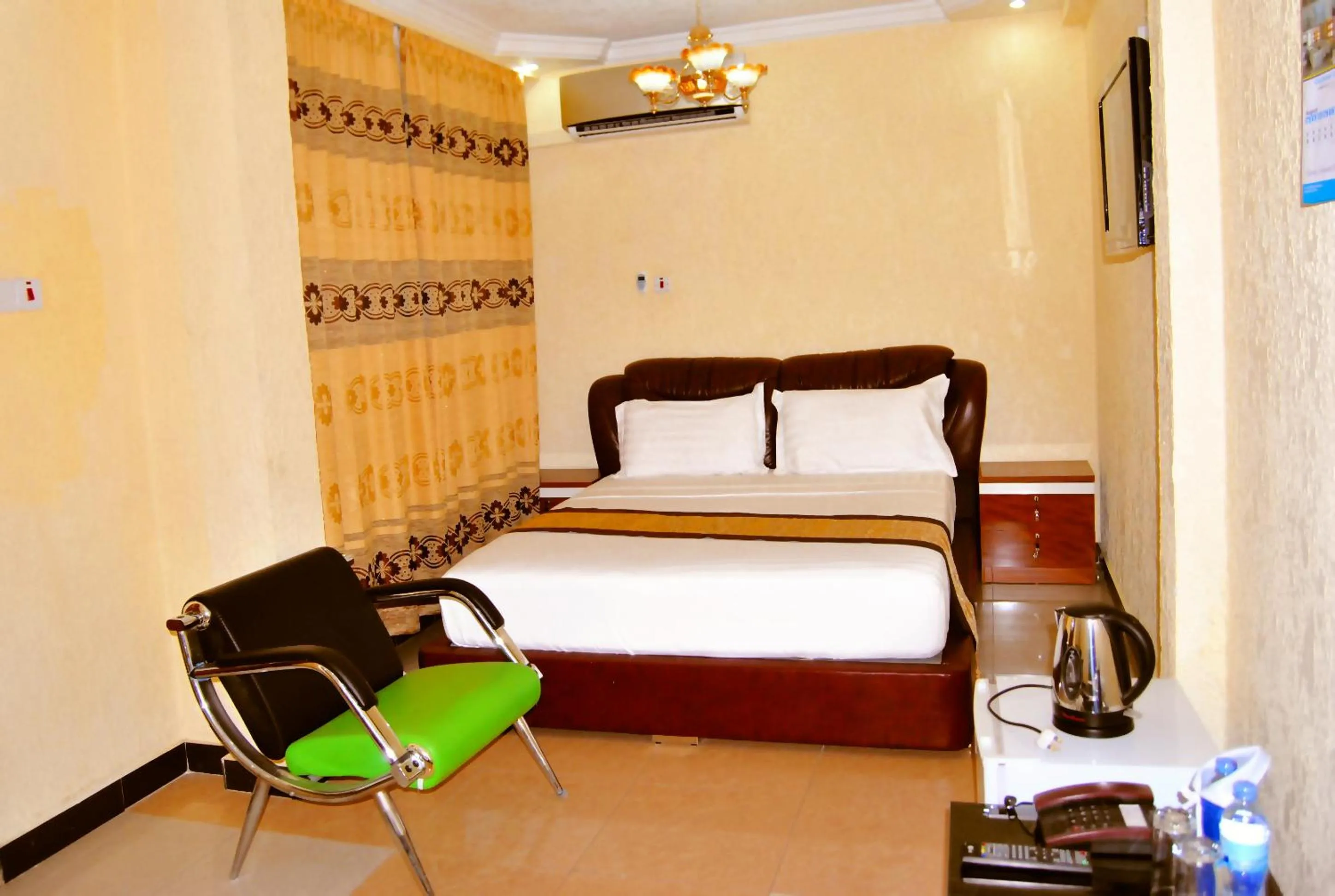 Bed, Seating Area in Best Point Hotel