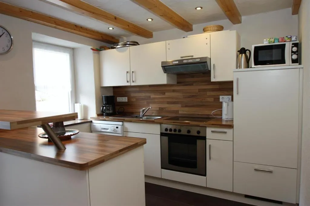 Kitchen or kitchenette in Gasthaus Pension Geimer