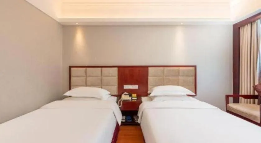 Bed in Overseas Chinese Hotel