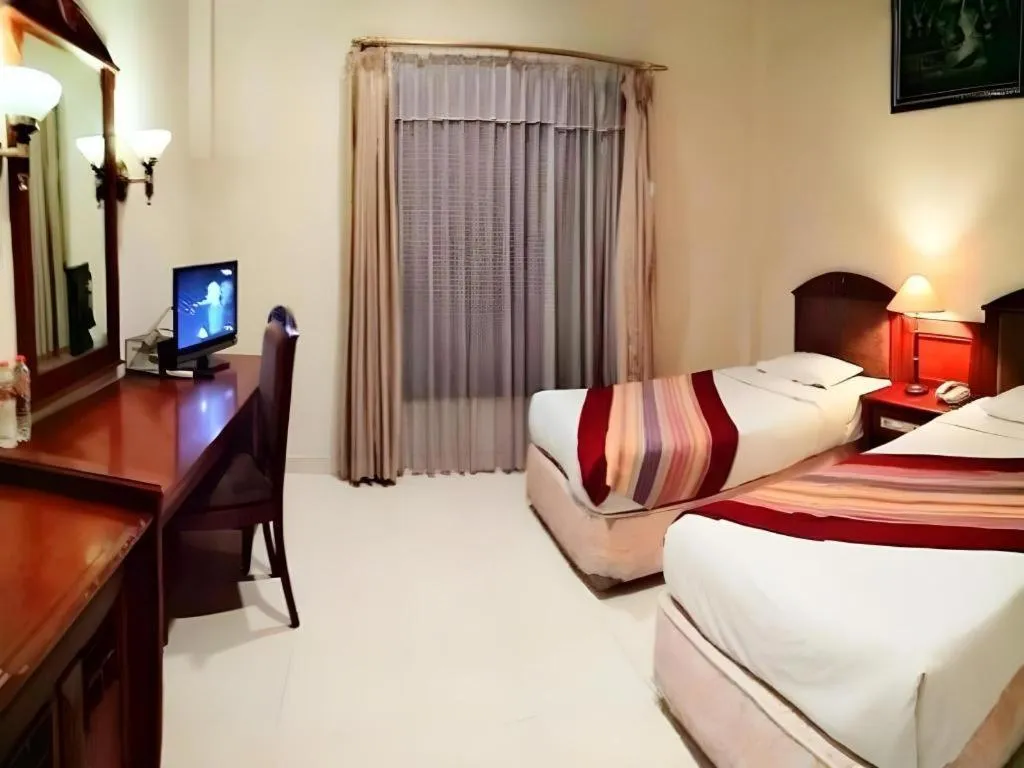 Bed in Larisae Setia Kawan Hotel