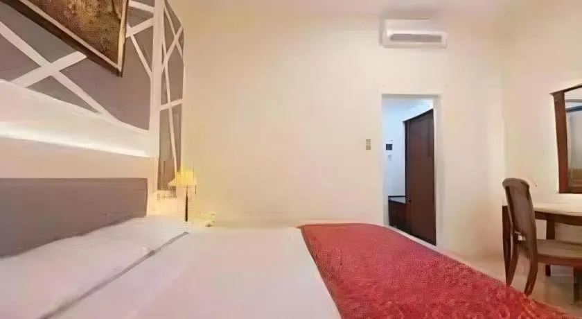 Bed in Larisae Setia Kawan Hotel