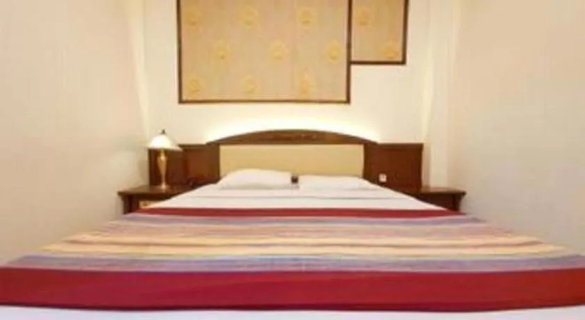 Bed in Larisae Setia Kawan Hotel