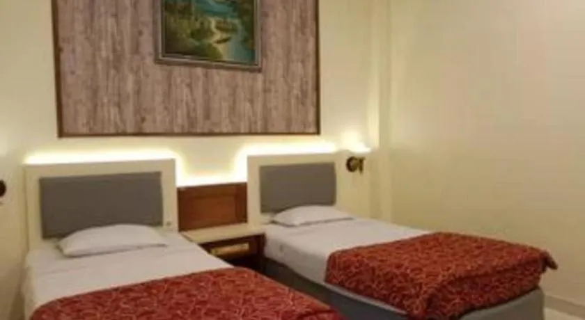 Bed in Larisae Setia Kawan Hotel