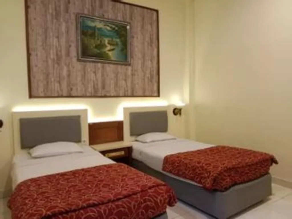 Bed in Larisae Setia Kawan Hotel