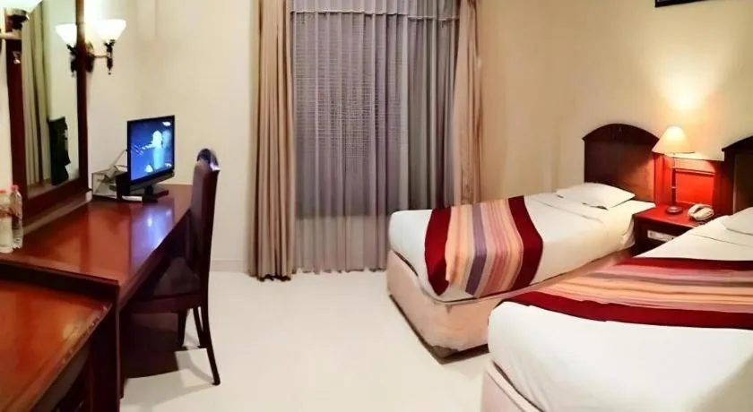 Bed in Larisae Setia Kawan Hotel