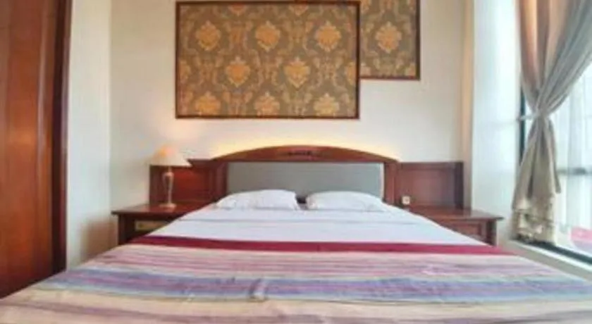 Bed in Larisae Setia Kawan Hotel