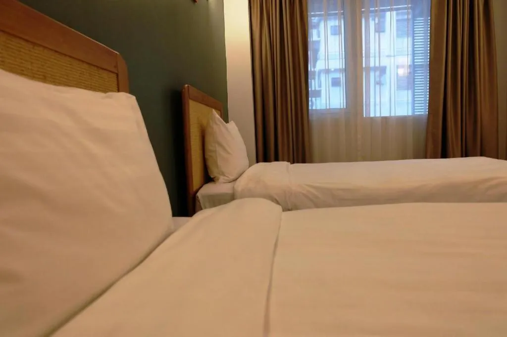 Bed in Cozy At 9 Hotel And Kitchen