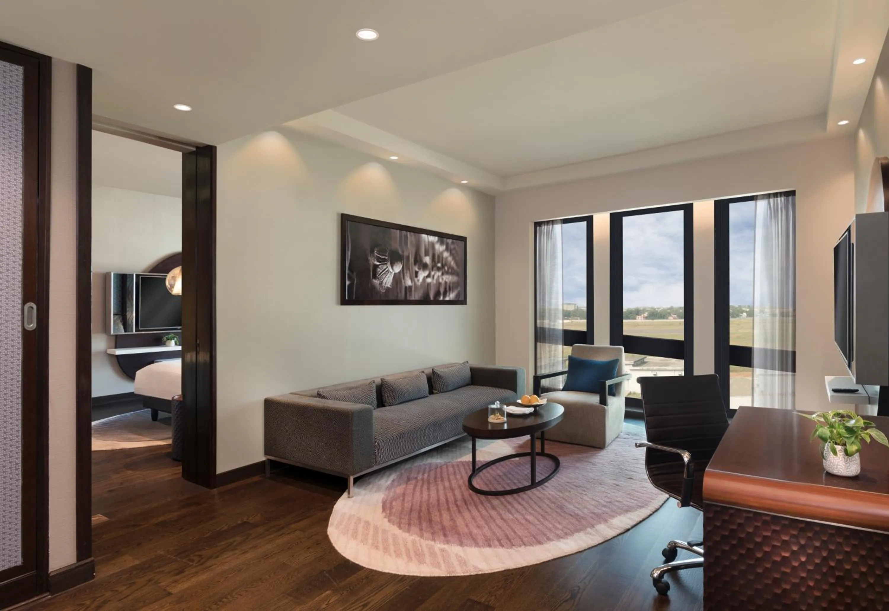 Living room, Bed in Pullman New Delhi Aerocity