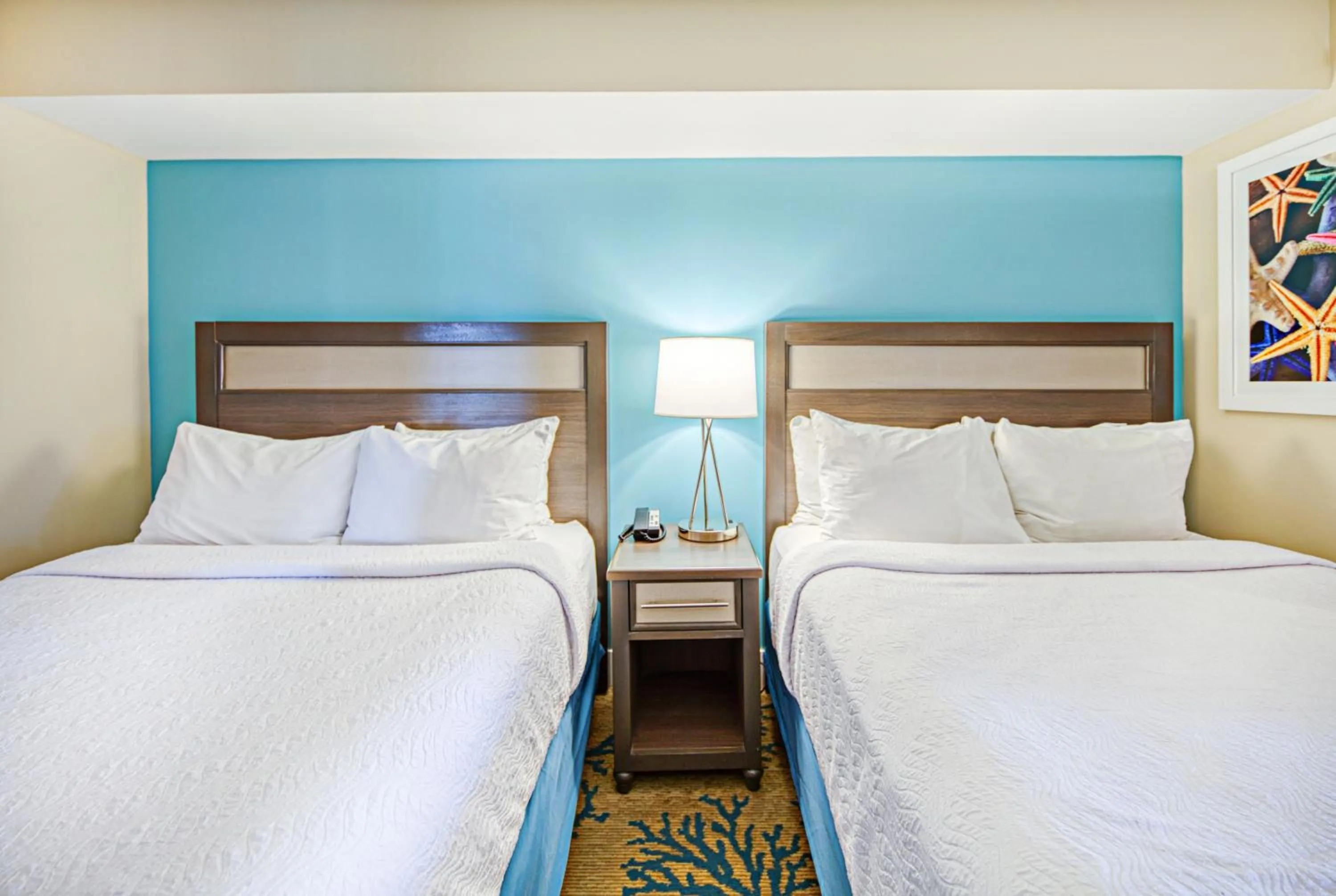 Bed in Commander Hotel & Suites