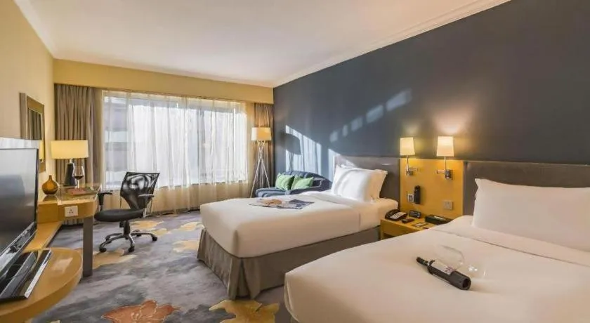 Bed in Beijing New World Center Tongpai Hotel