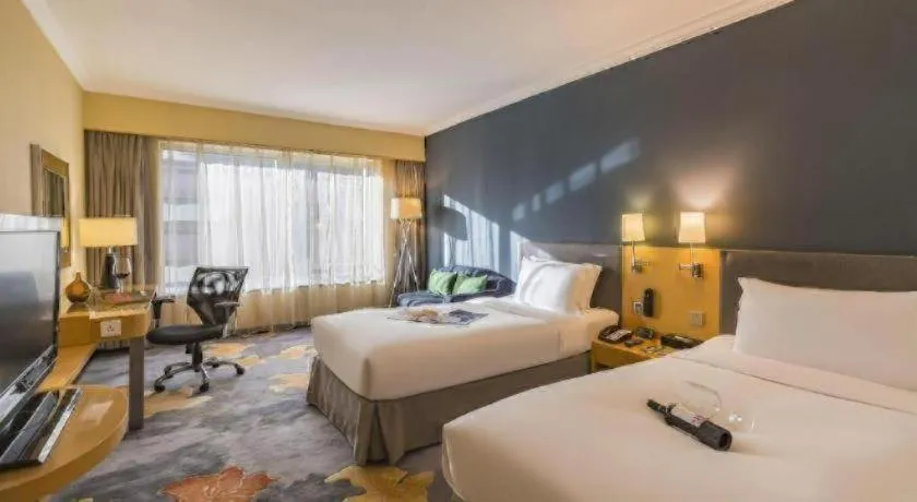 Bed in Beijing New World Center Tongpai Hotel