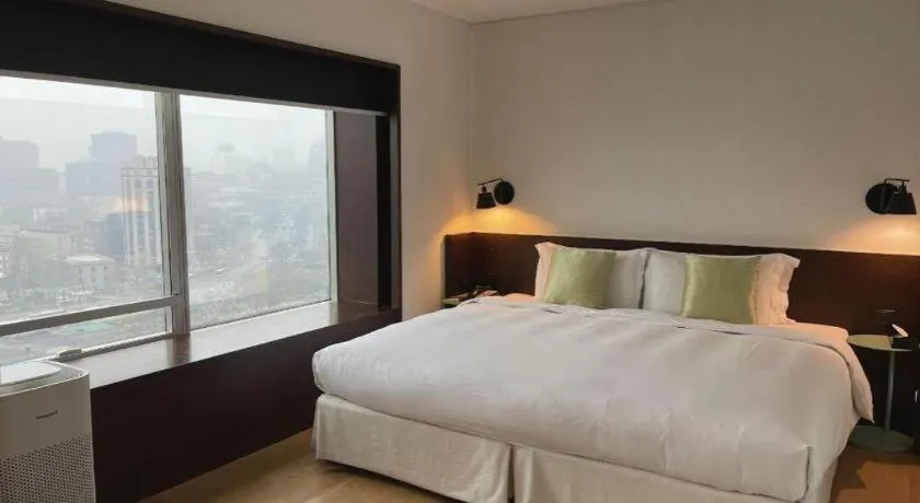 Bed in Beijing New World Center Tongpai Hotel
