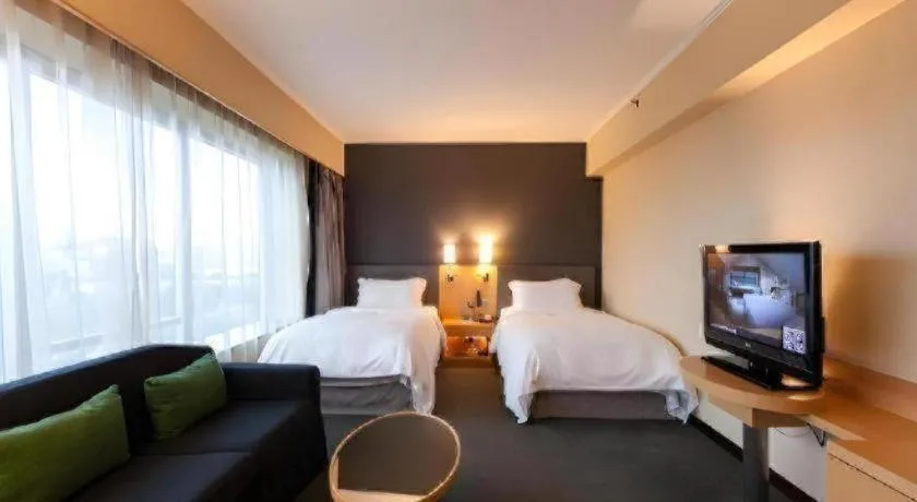 Bed in Beijing New World Center Tongpai Hotel