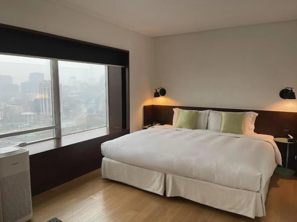 Bed in Beijing New World Center Tongpai Hotel