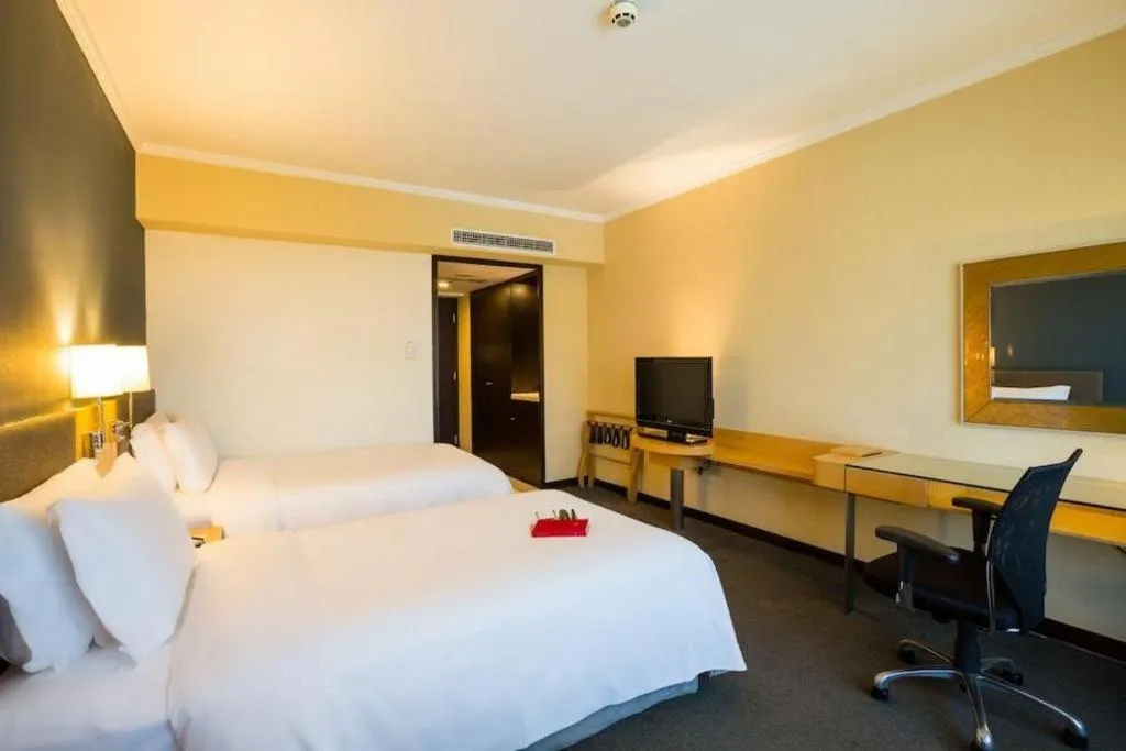 Bed in Beijing New World Center Tongpai Hotel