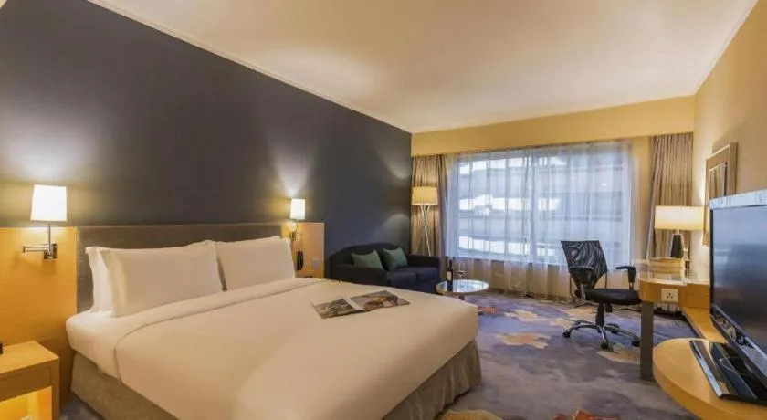 Bed in Beijing New World Center Tongpai Hotel