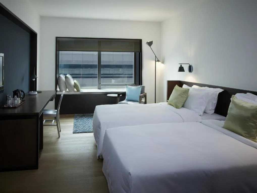 Bed in Beijing New World Center Tongpai Hotel