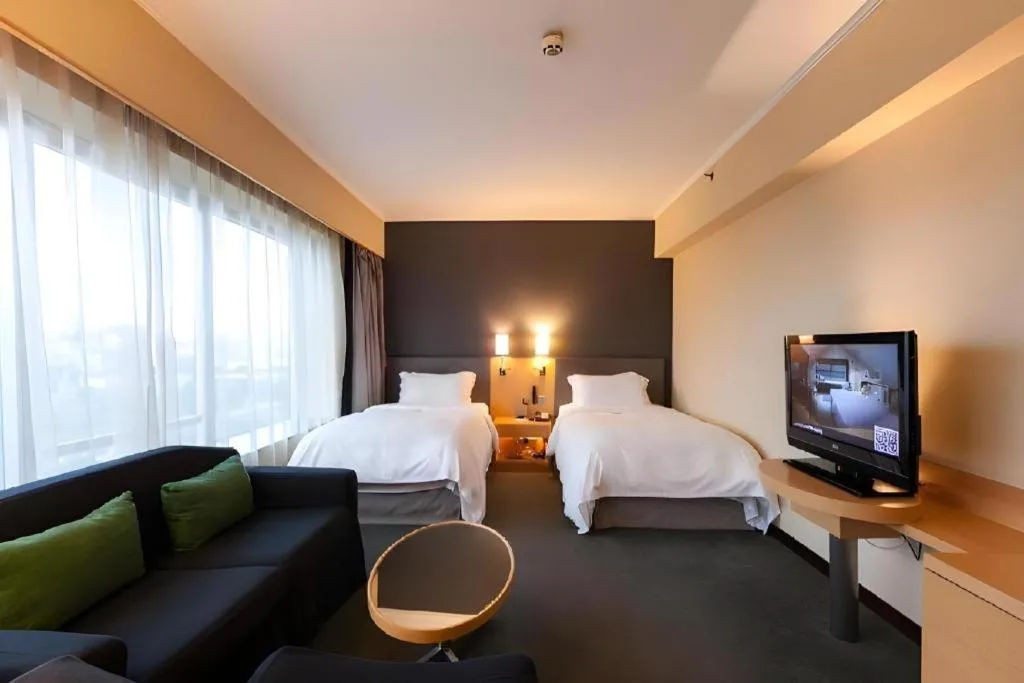 Bed in Beijing New World Center Tongpai Hotel