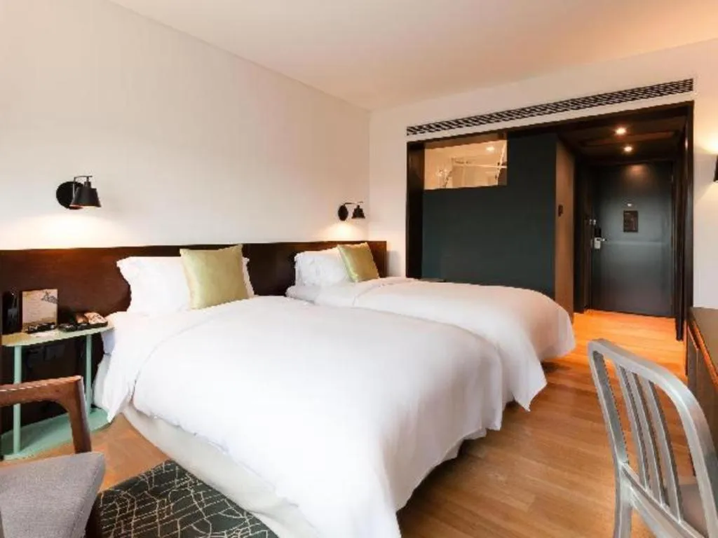 Bed in Beijing New World Center Tongpai Hotel