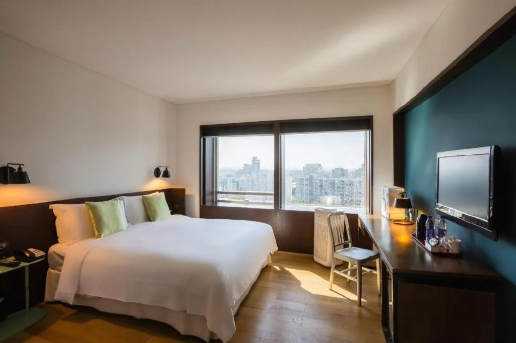 Bed in Beijing New World Center Tongpai Hotel