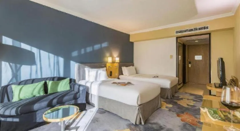 Bed in Beijing New World Center Tongpai Hotel