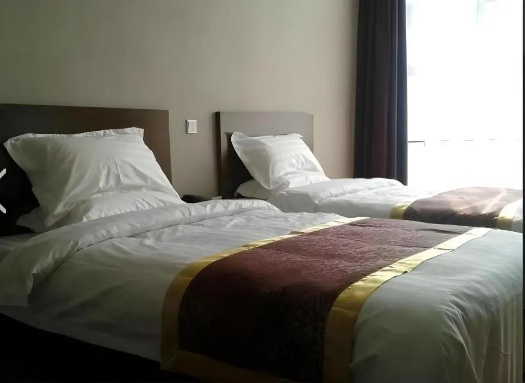 Bed in Beijing Jinjiang Fuyuan Hotel