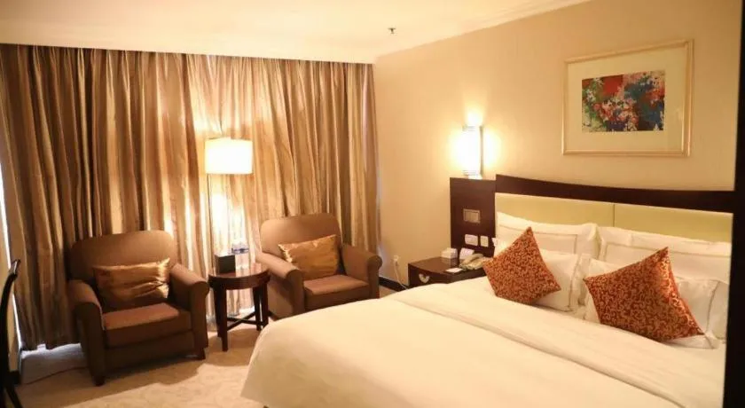 Bed in Beijing Jinjiang Fuyuan Hotel