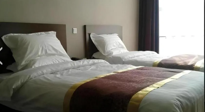 Bed in Beijing Jinjiang Fuyuan Hotel